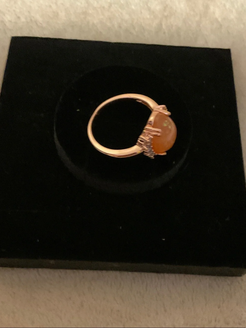 Gold-Tone Ring with Orange Opal Center and Clear Accent Stones